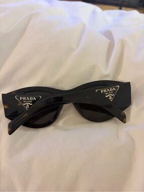 Prada Milano Women's Black Cat-Eye Sunglasses with Gold Logo